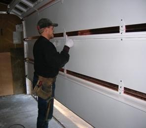 We perform assembly of sectional doors